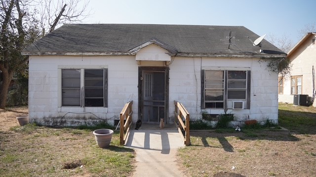 a front view of a house with patio