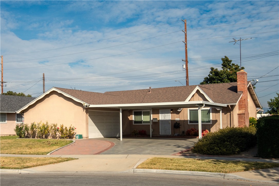 4121 Broadmoor Street Riverside, CA 92503 - Photo 1 of 1 a front view of a house with a yard