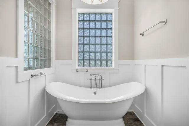 a bathroom with a sink and a window