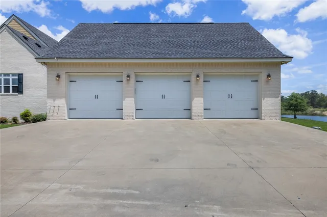 a big house with a big yard and large trees