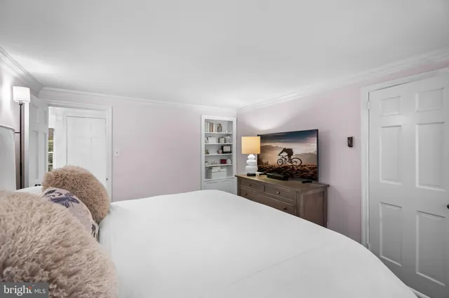 a spacious bathroom with a double vanity sink toilet and shower