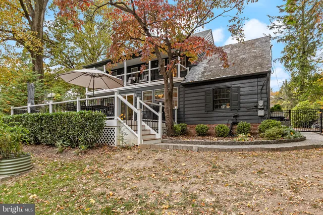 a view of deck with furniture and garden
