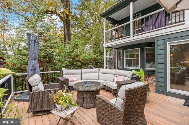 a view of a room with furniture and wooden floor