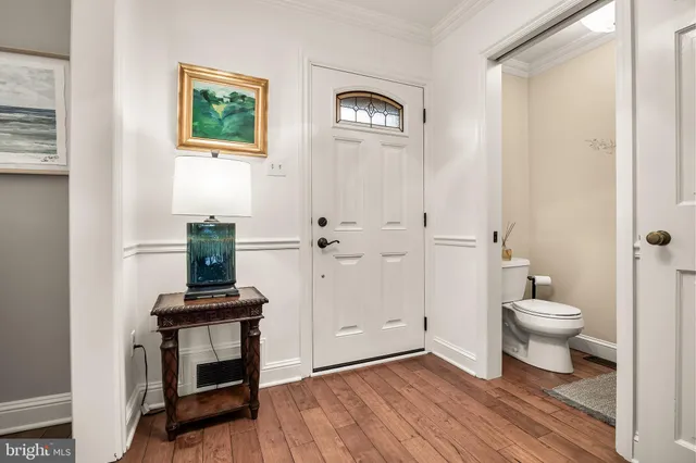 a bathroom with a toilet a sink and a mirror