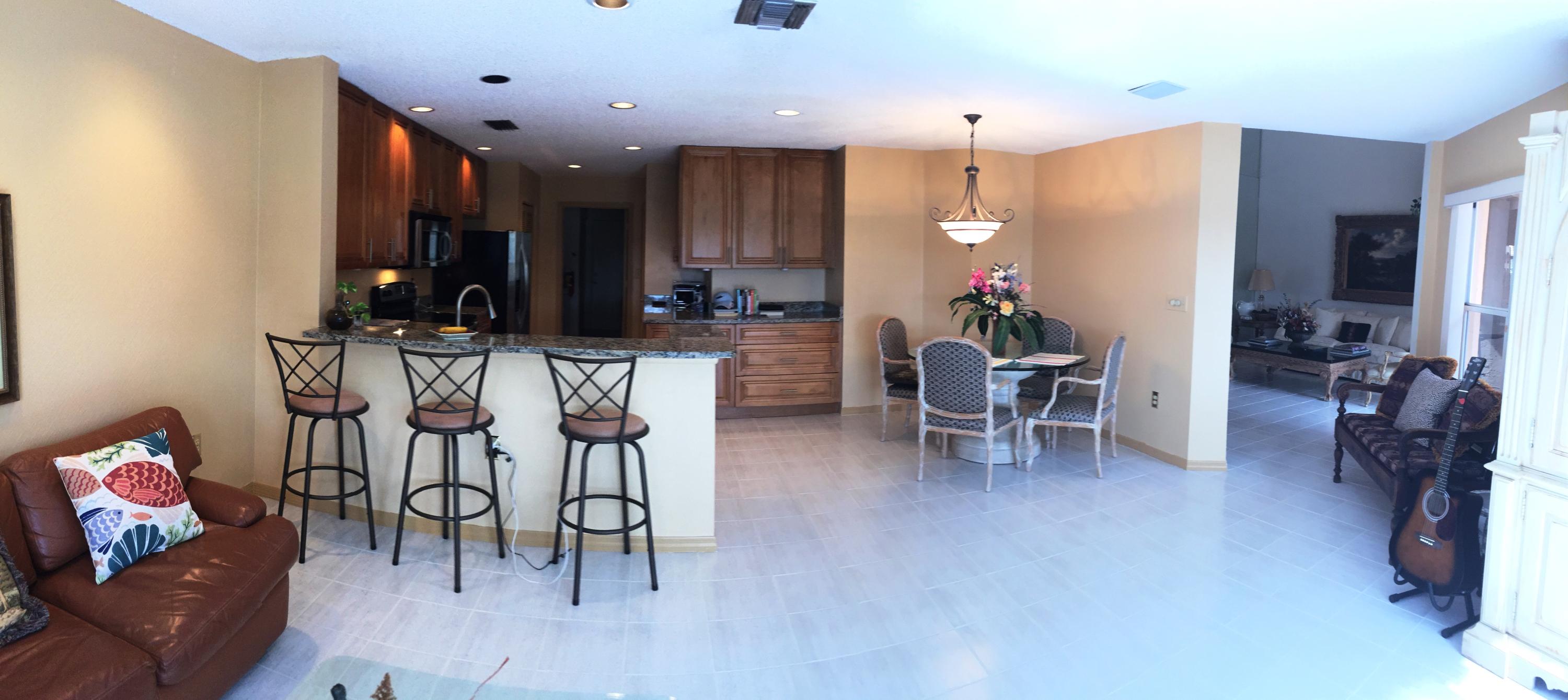 5254 Windsor Parke Drive Boca Raton, FL 33496 - Photo 13 of 25 a view of a dining room with furniture and kitchen view