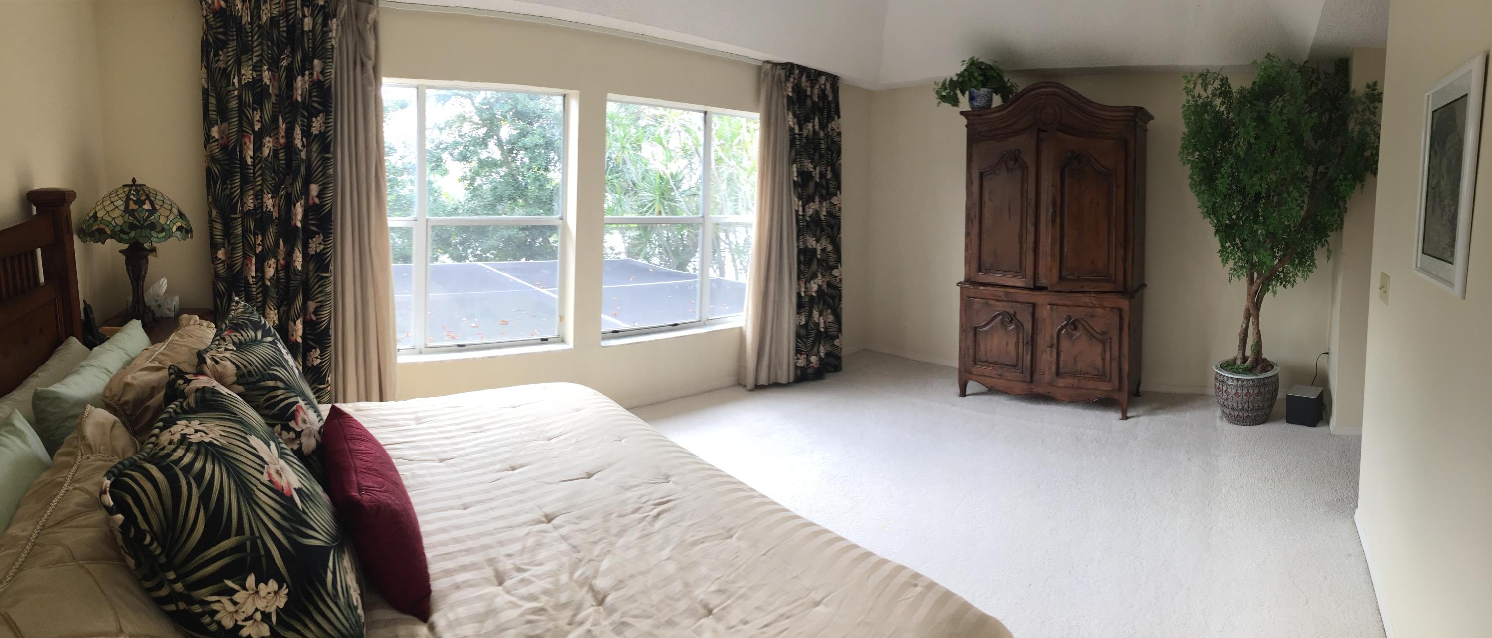 5254 Windsor Parke Drive Boca Raton, FL 33496 - Photo 17 of 25 a view of a bedroom with a bed and glass door
