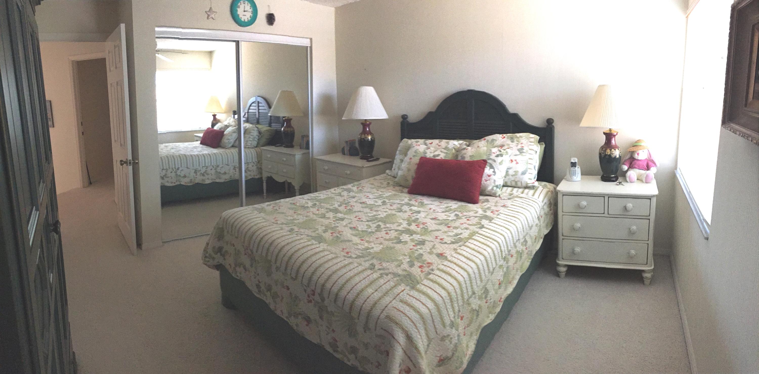 5254 Windsor Parke Drive Boca Raton, FL 33496 - Photo 20 of 25 a bed sitting in a bedroom next to a window