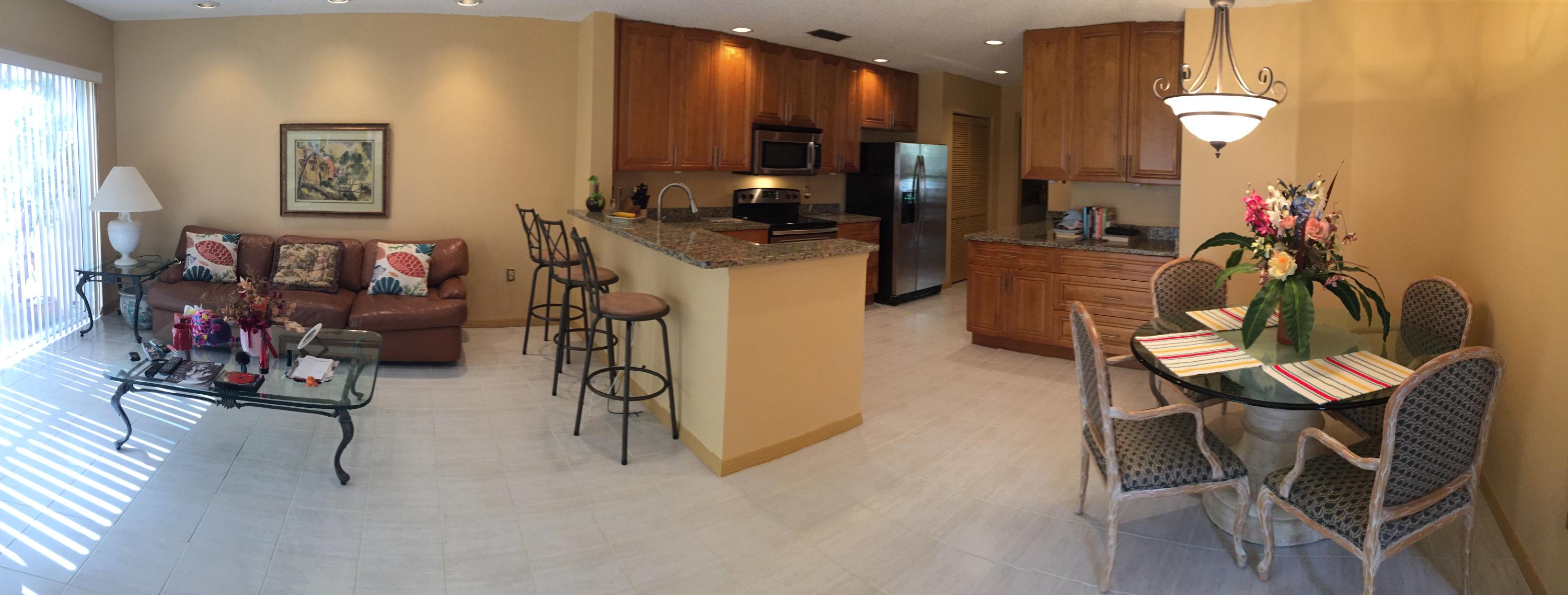 5254 Windsor Parke Drive Boca Raton, FL 33496 - Photo 8 of 25 a view of a dining room with furniture and a kitchen