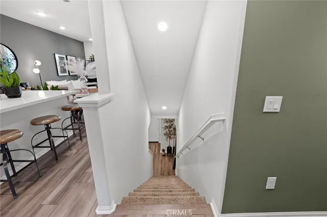 a view of a hallway with furniture and entryway