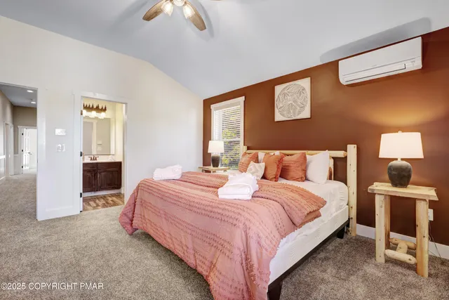 a living room with furniture a rug and a flat screen tv