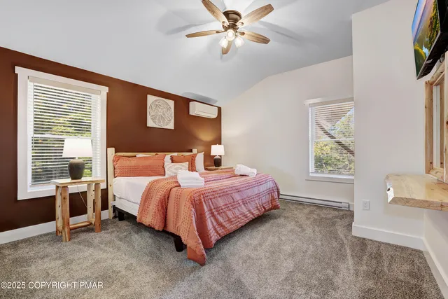 a room with pool table and windows