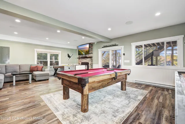 a spacious bedroom with two beds and a chandelier