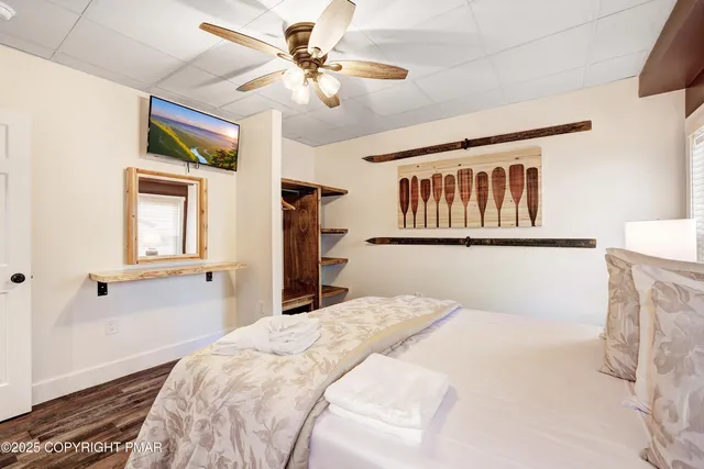 a bedroom with bed and a chandelier