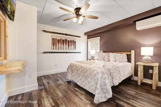 a bed room with bed and a tv