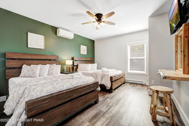 a room with pool table and windows