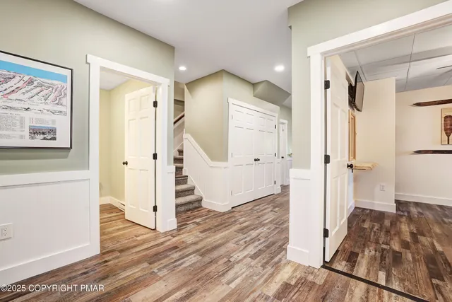a view of a patio with table and chairs and wooden floor