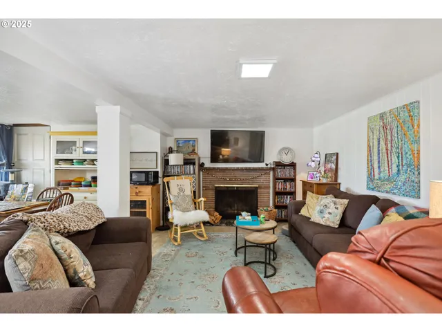 a living room with furniture fireplace and a flat screen tv
