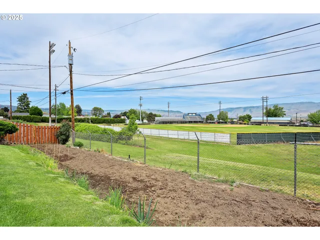 a view of a golf course with a park