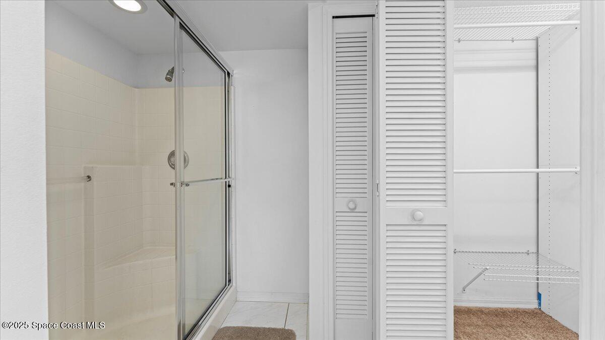 212 Crystal Lake Road Melbourne, FL 32901 - Photo 24 of 38 a bathroom with a shower