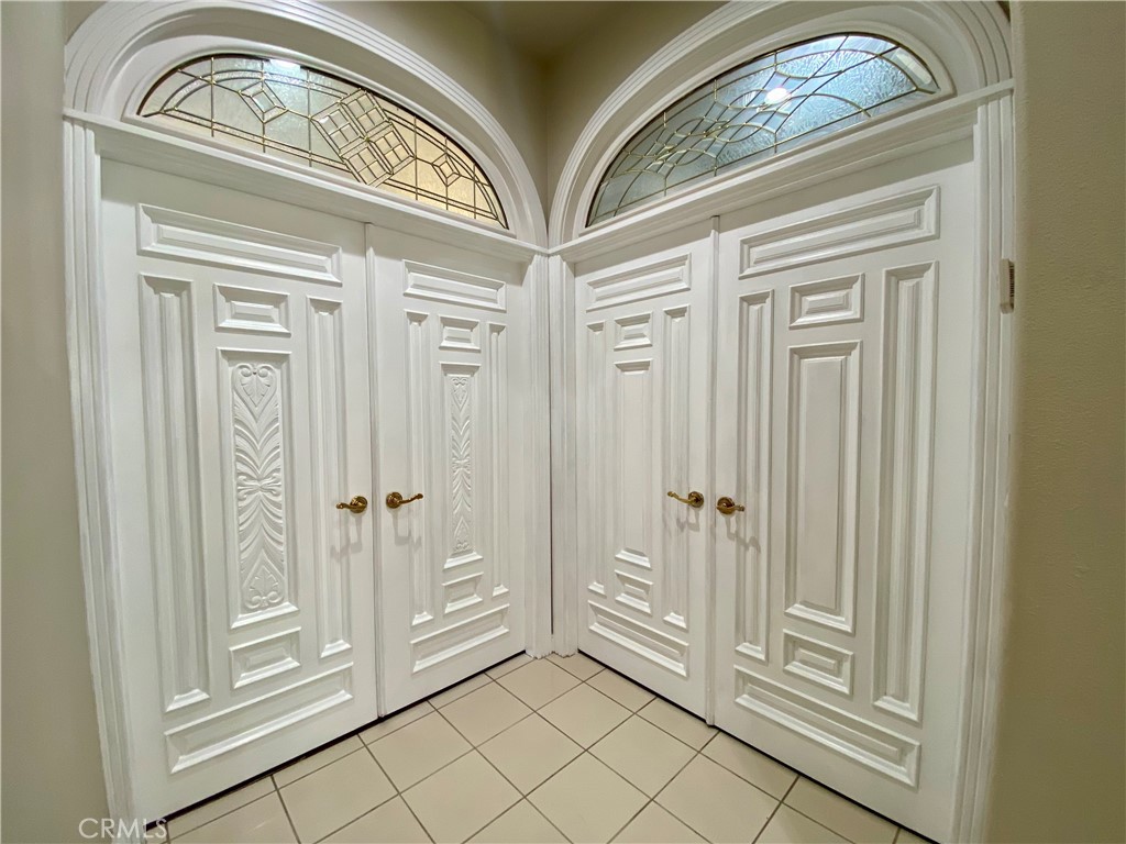 11019 Rives Avenue Downey, CA 90241 - Photo 11 of 35 a view of a entryway door with chandelier