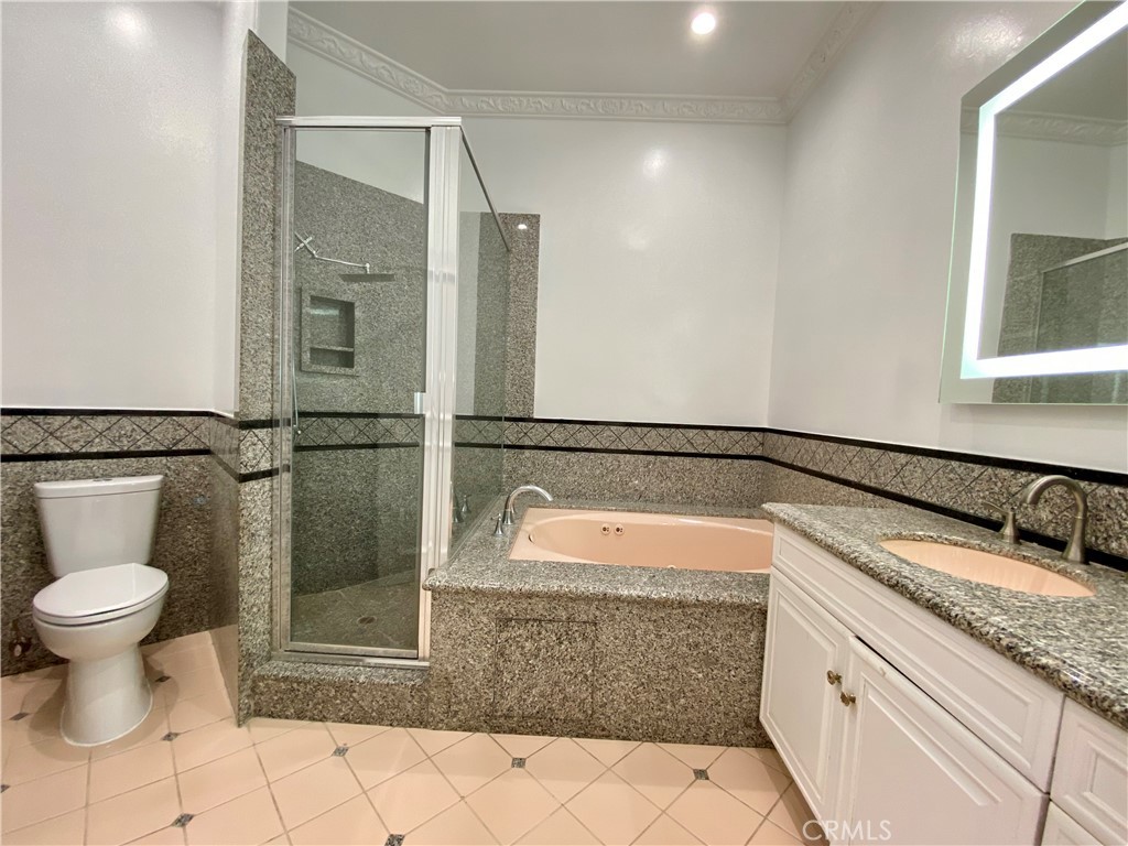 11019 Rives Avenue Downey, CA 90241 - Photo 16 of 35 a bathroom with a sink toilet and shower