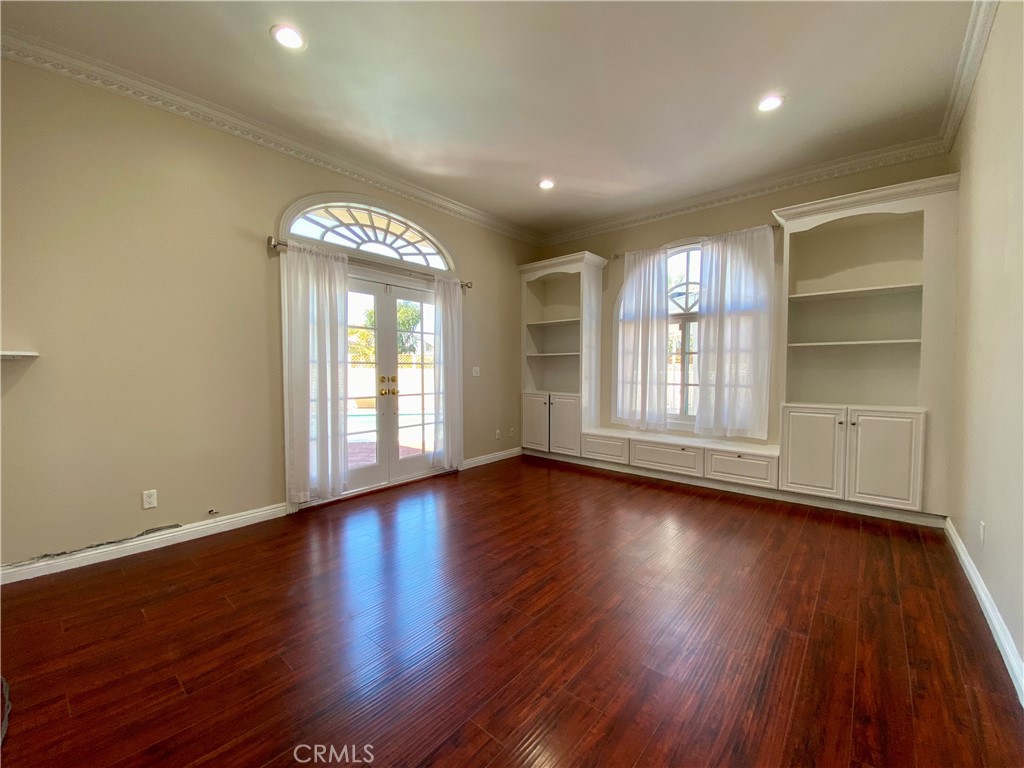 11019 Rives Avenue Downey, CA 90241 - Photo 17 of 35 a view of empty room with wooden floor and fan