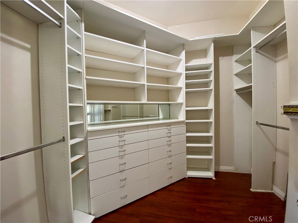 11019 Rives Avenue Downey, CA 90241 - Photo 18 of 35 a view of walk in closet with empty racks