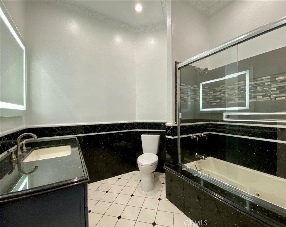 11019 Rives Avenue Downey, CA 90241 - Photo 19 of 35 a bathroom with a sink and a toilet