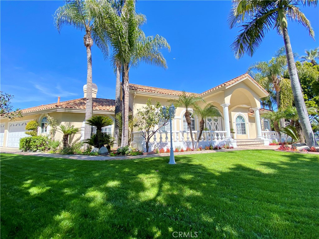11019 Rives Avenue Downey, CA 90241 - Photo 2 of 35 a view of a house with a yard and sitting area