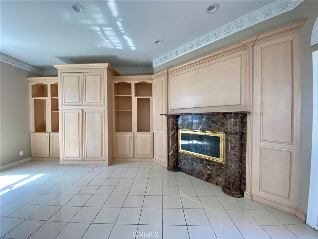 11019 Rives Avenue Downey, CA 90241 - Photo 27 of 35 a view of a livingroom with an empty space and a fireplace