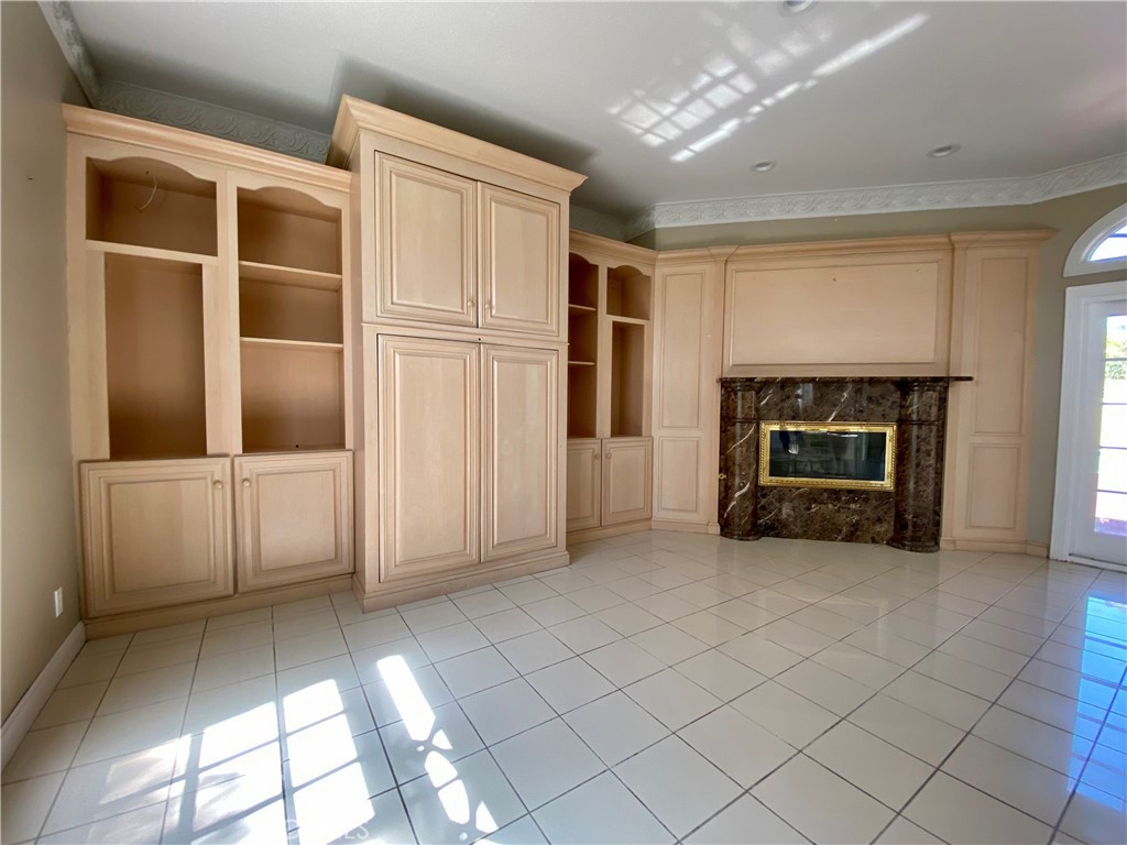 11019 Rives Avenue Downey, CA 90241 - Photo 28 of 35 a view of a livingroom with an empty space and a fireplace