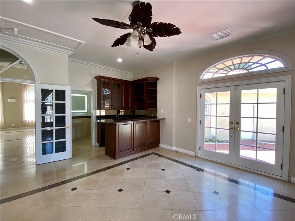 11019 Rives Avenue Downey, CA 90241 - Photo 29 of 35 a view of an empty room with a window and kitchen view