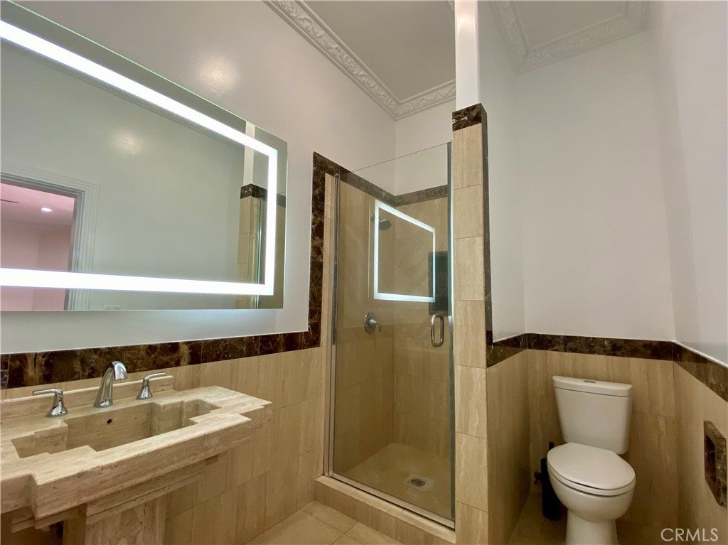 11019 Rives Avenue Downey, CA 90241 - Photo 30 of 35 a bathroom with a sink toilet and shower