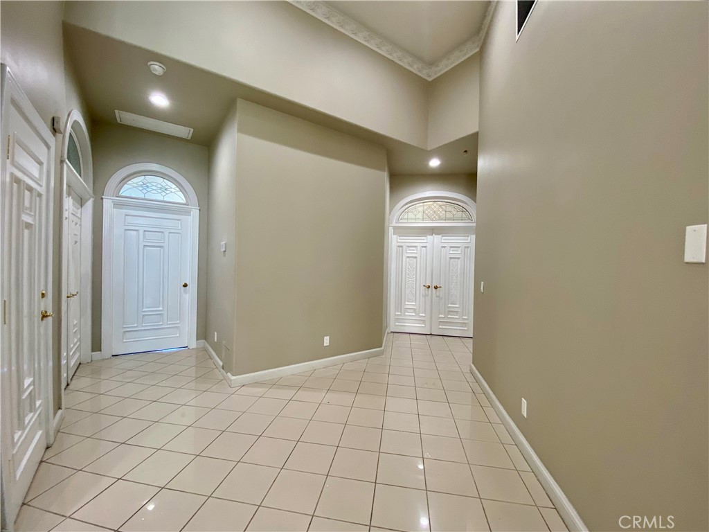 11019 Rives Avenue Downey, CA 90241 - Photo 9 of 35 a view of a hallway with closet and mirror