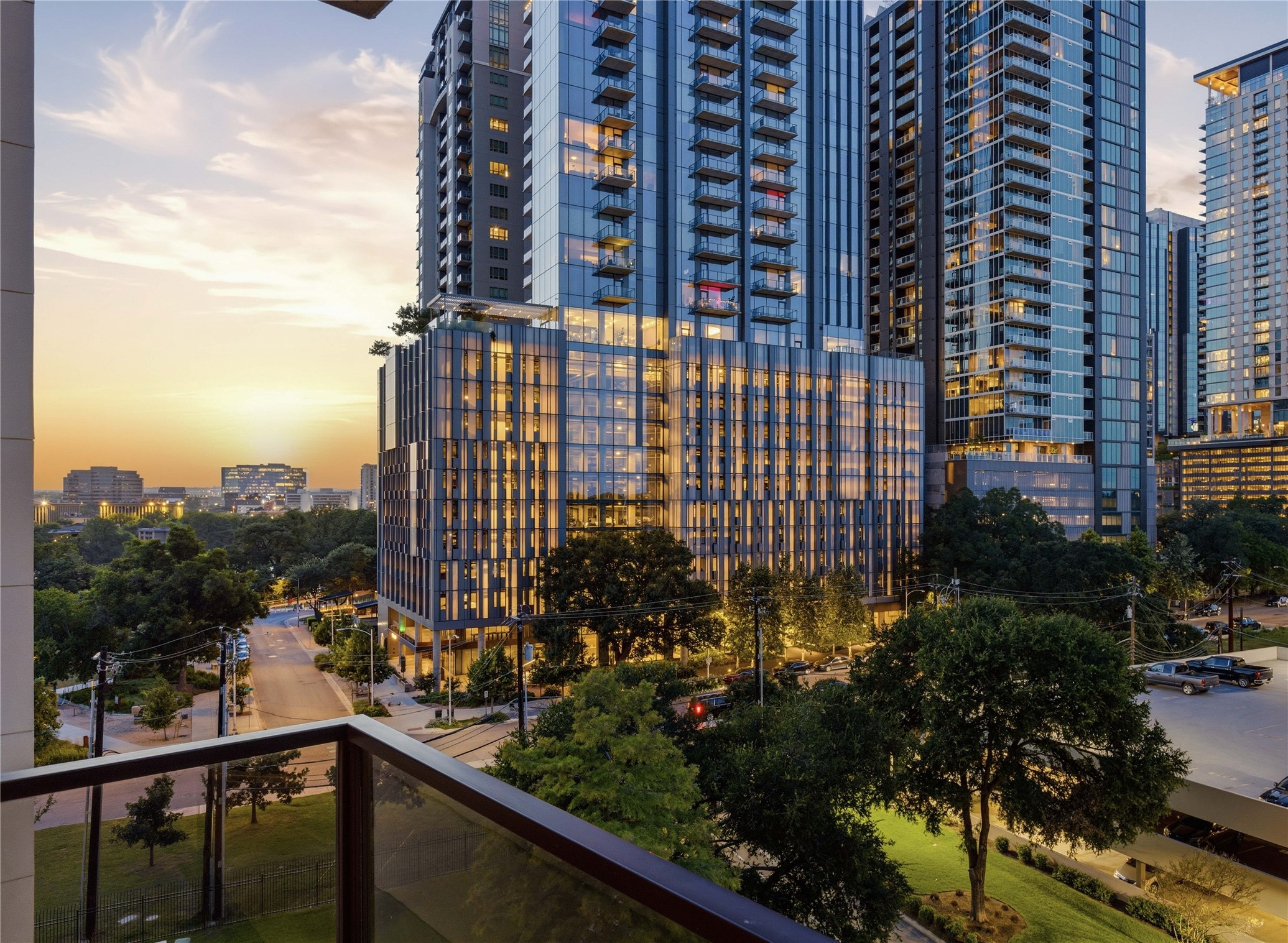 40 North Interstate Highway 35, Unit 7B1 Austin, TX 78701 - Photo 1 of 21 City lights illuminate modern high-rise buildings at dusk, offering a captivating metropolitan panorama.