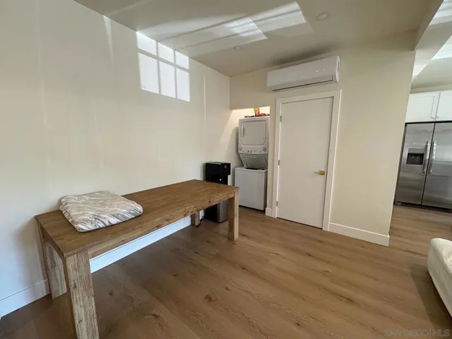 a view of a livingroom with furniture and wooden floor