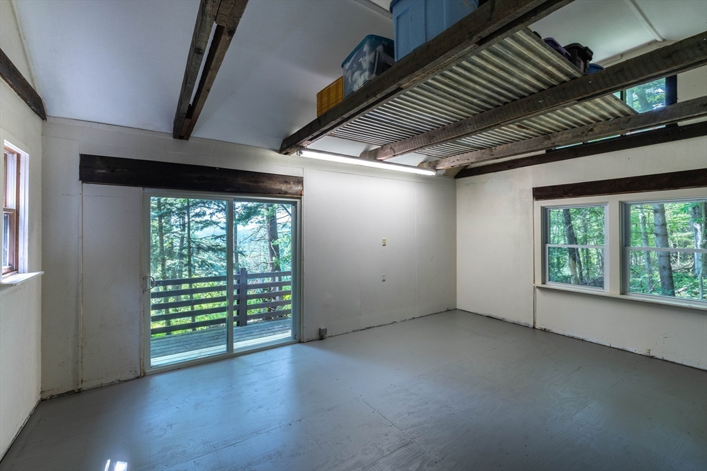 15 Cole Road Williamsburg, MA 01039 - Photo 27 of 35 an empty room with wooden floor and windows