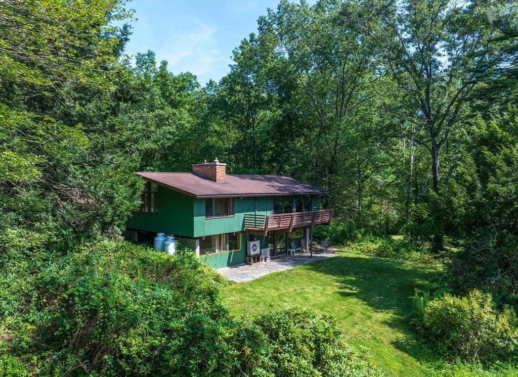 15 Cole Road Williamsburg, MA 01039 - Photo 31 of 35 a view of a chair and table in backyard of the house