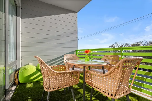 a patio with a yard table and chairs
