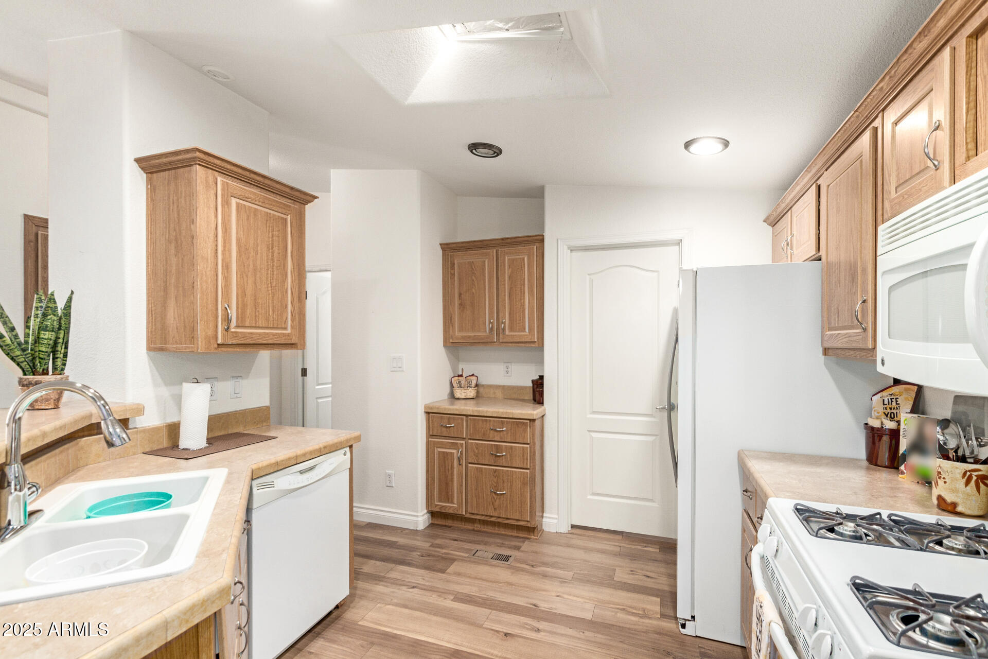 2929 East Main Street, Unit 83 Mesa, AZ 85213 - Photo 10 of 34 a kitchen with a sink stove and refrigerator