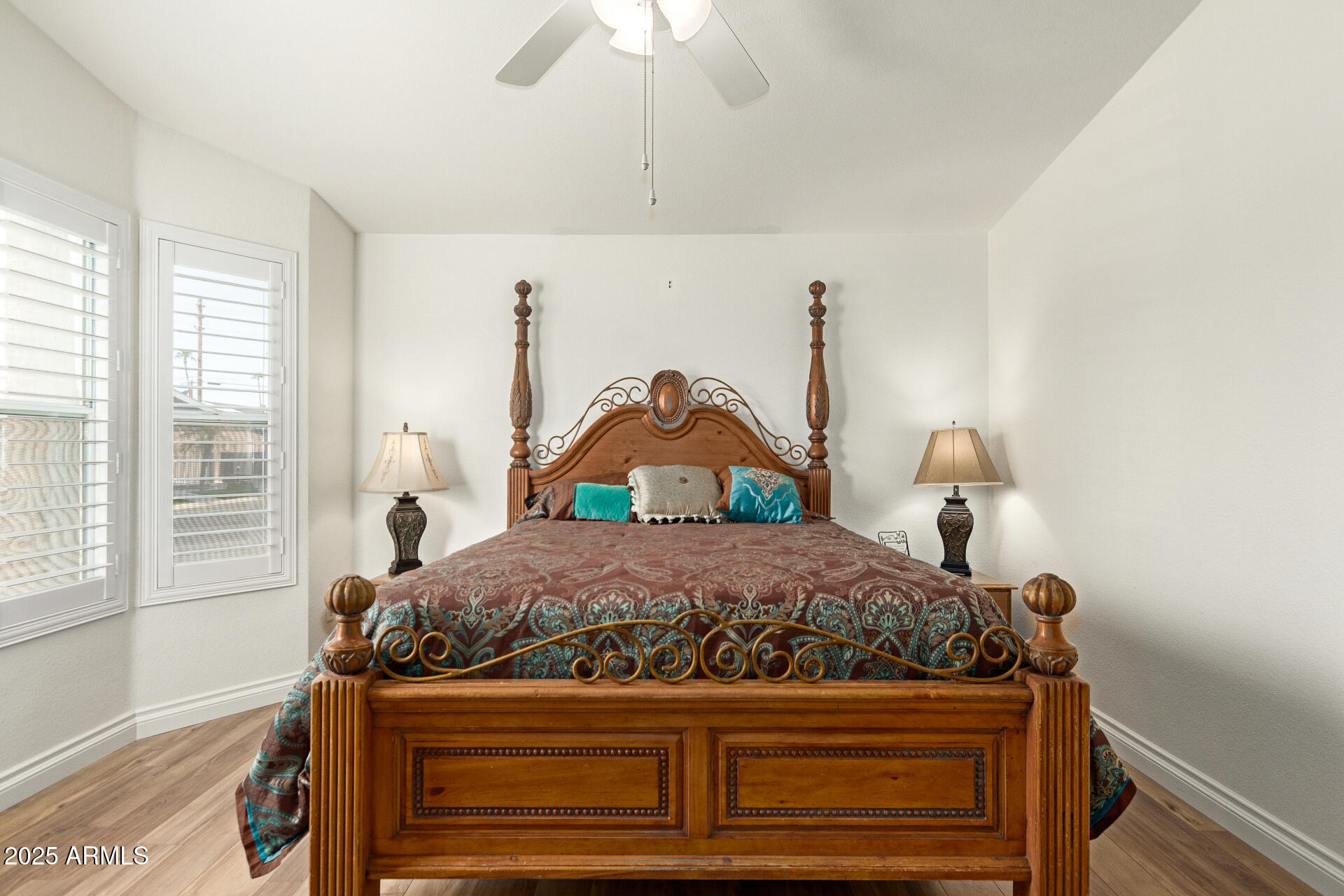 2929 East Main Street, Unit 83 Mesa, AZ 85213 - Photo 14 of 34 a living room with a bed and a chandelier