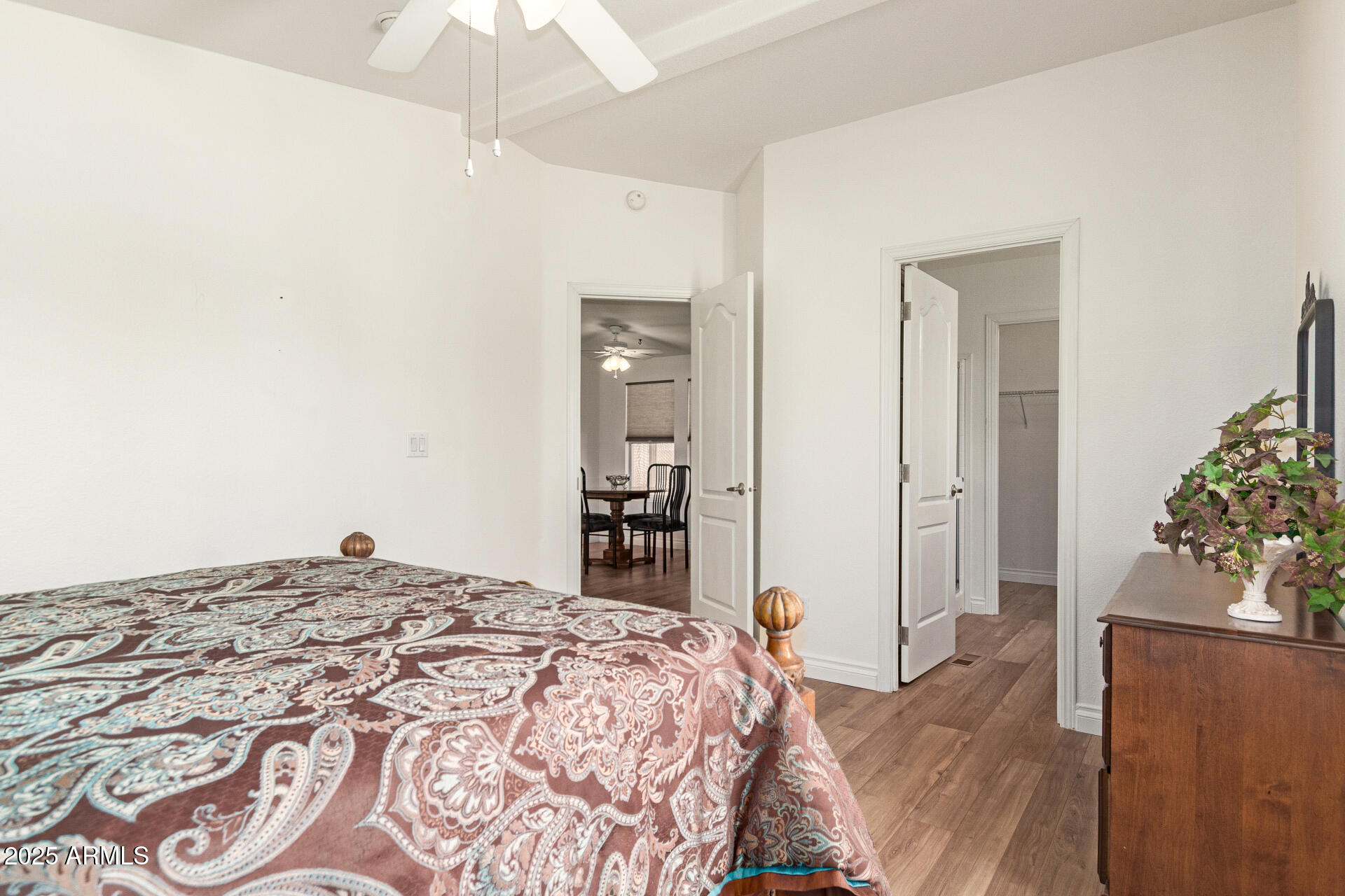 2929 East Main Street, Unit 83 Mesa, AZ 85213 - Photo 15 of 34 a bedroom with a bed and a chandelier