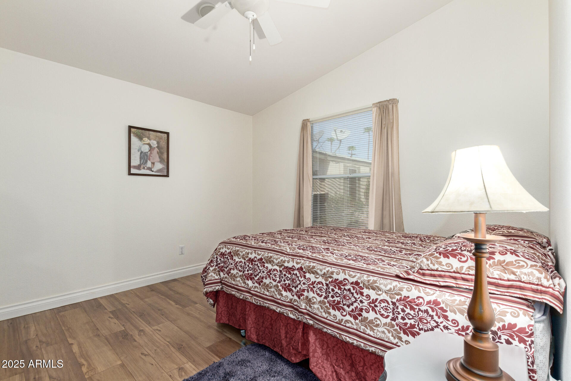 2929 East Main Street, Unit 83 Mesa, AZ 85213 - Photo 19 of 34 a bedroom with a bed and a chandelier