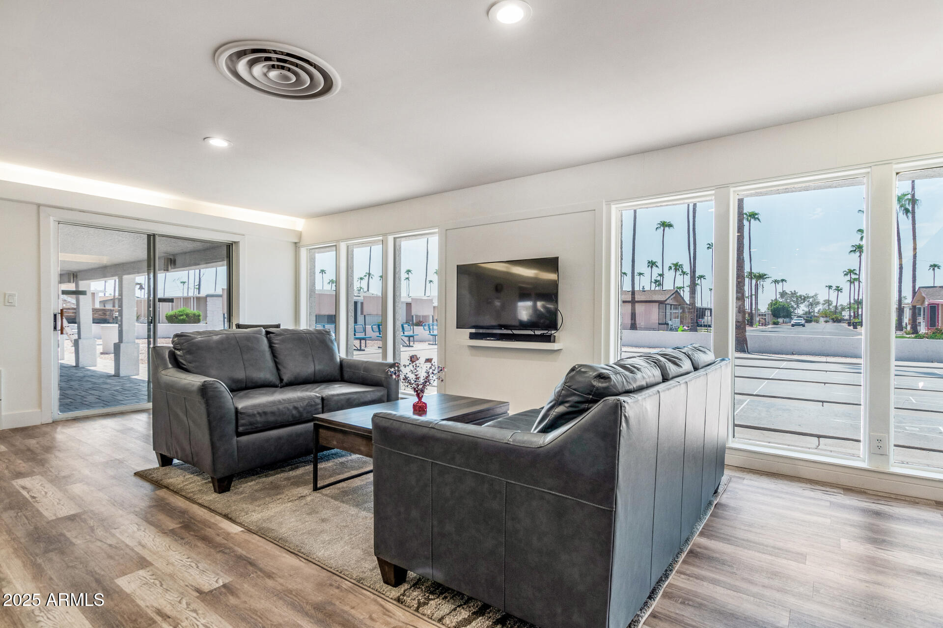 2929 East Main Street, Unit 83 Mesa, AZ 85213 - Photo 25 of 34 a living room with furniture and a flat screen tv