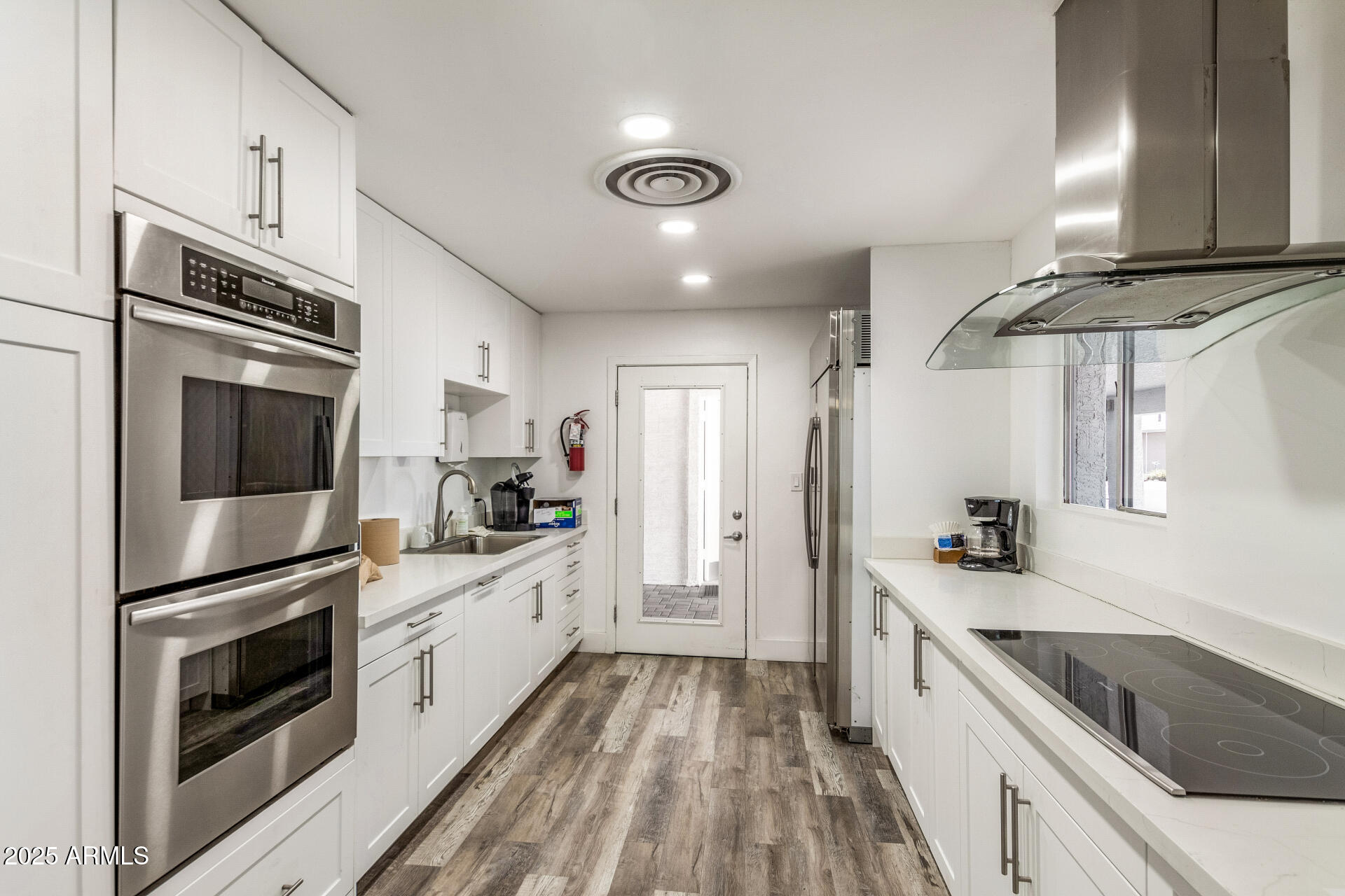 2929 East Main Street, Unit 83 Mesa, AZ 85213 - Photo 26 of 34 a kitchen with stainless steel appliances a stove microwave and a refrigerator