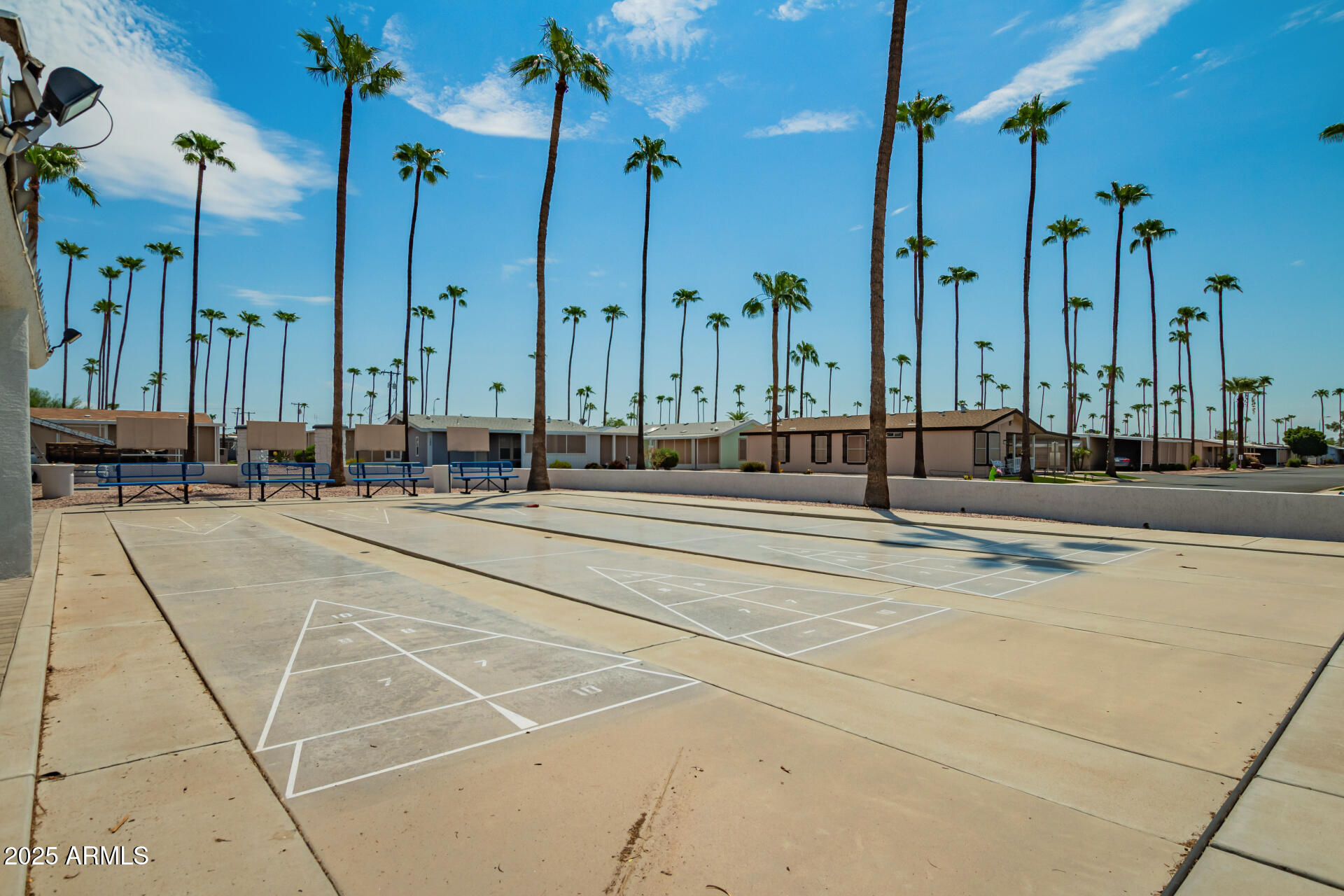 2929 East Main Street, Unit 83 Mesa, AZ 85213 - Photo 29 of 34 a swimming pool with outdoor seating