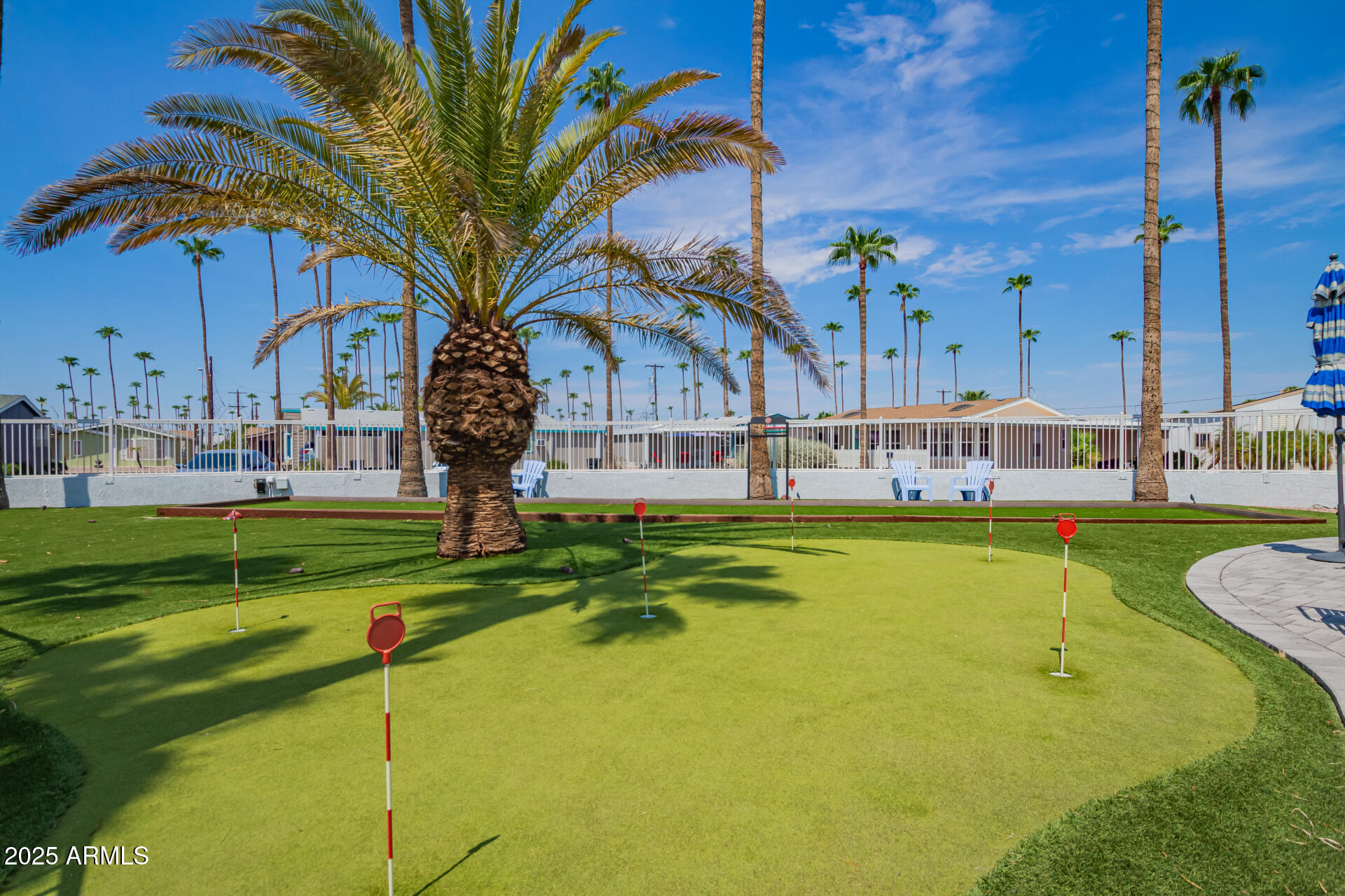 2929 East Main Street, Unit 83 Mesa, AZ 85213 - Photo 30 of 34 a swimming pool with outdoor seating and yard