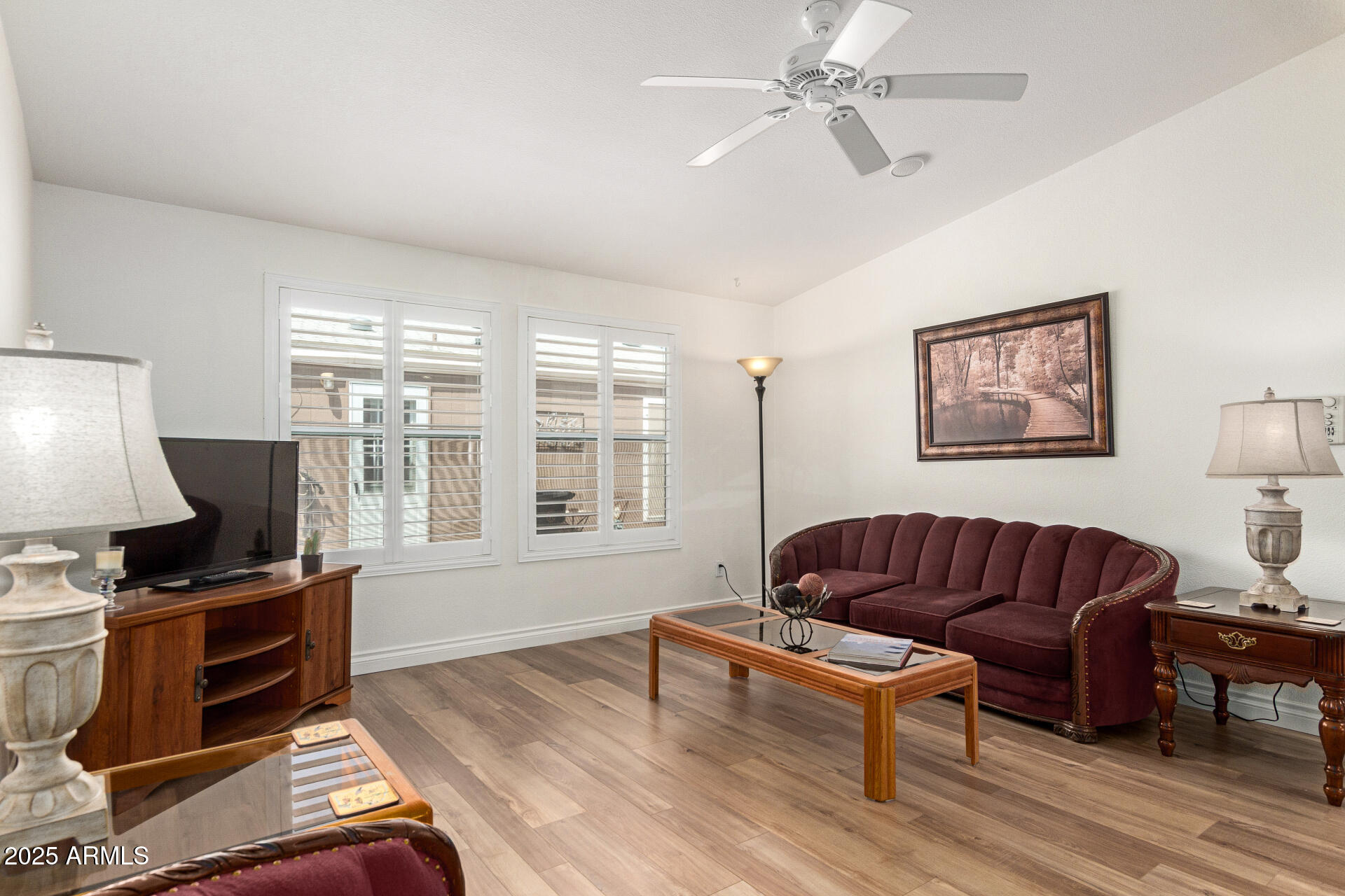 2929 East Main Street, Unit 83 Mesa, AZ 85213 - Photo 4 of 34 a living room with furniture and a flat screen tv