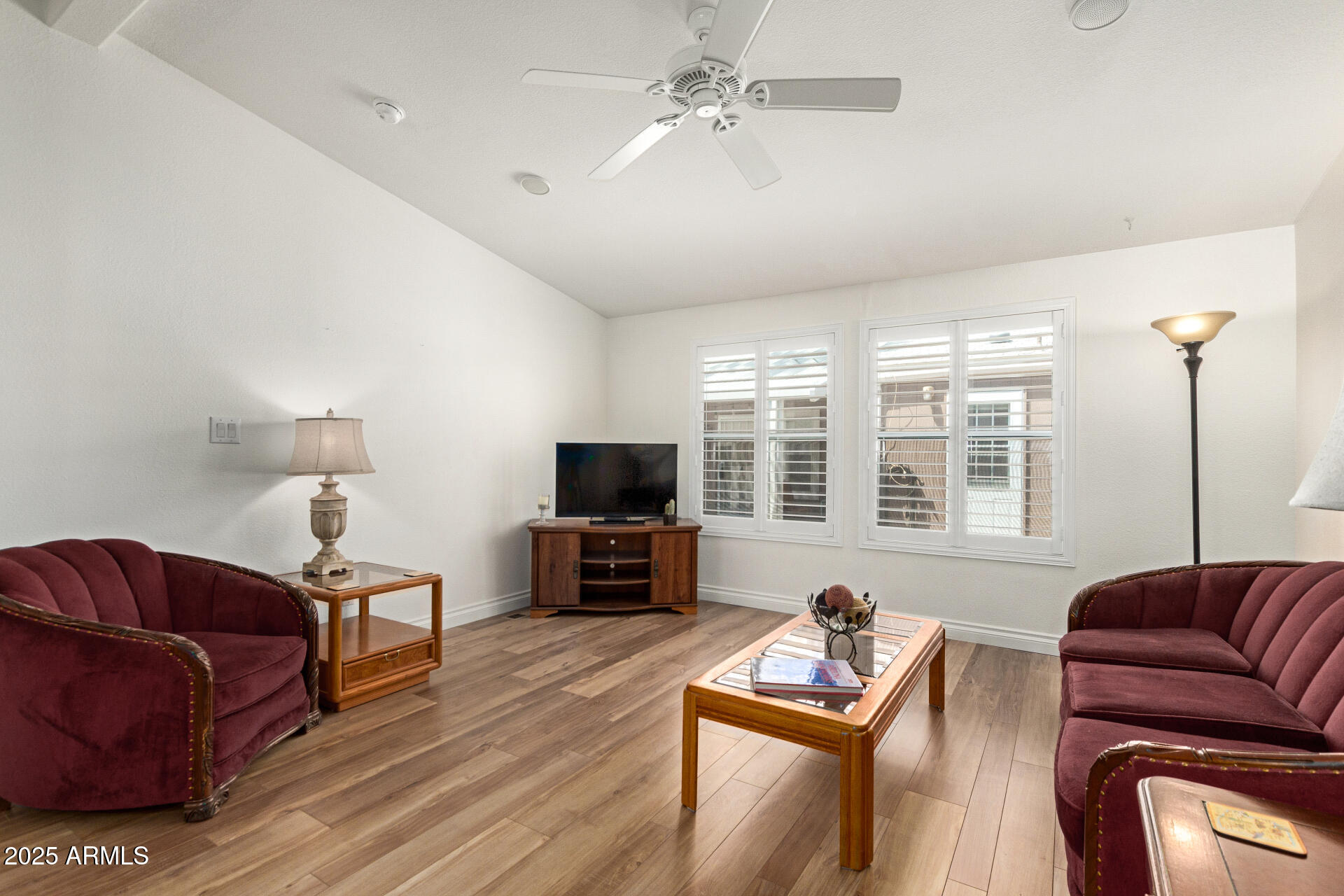 2929 East Main Street, Unit 83 Mesa, AZ 85213 - Photo 6 of 34 a living room with furniture a flat screen tv and a window