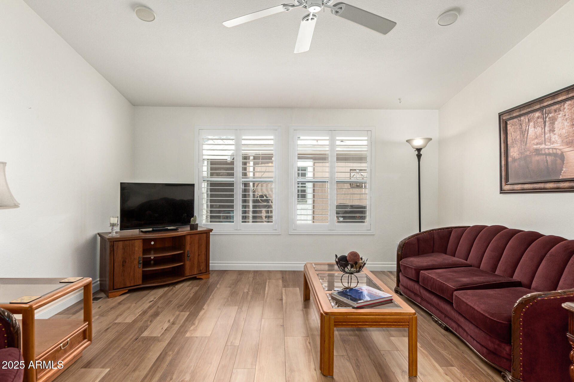 2929 East Main Street, Unit 83 Mesa, AZ 85213 - Photo 7 of 34 a living room with furniture and a flat screen tv